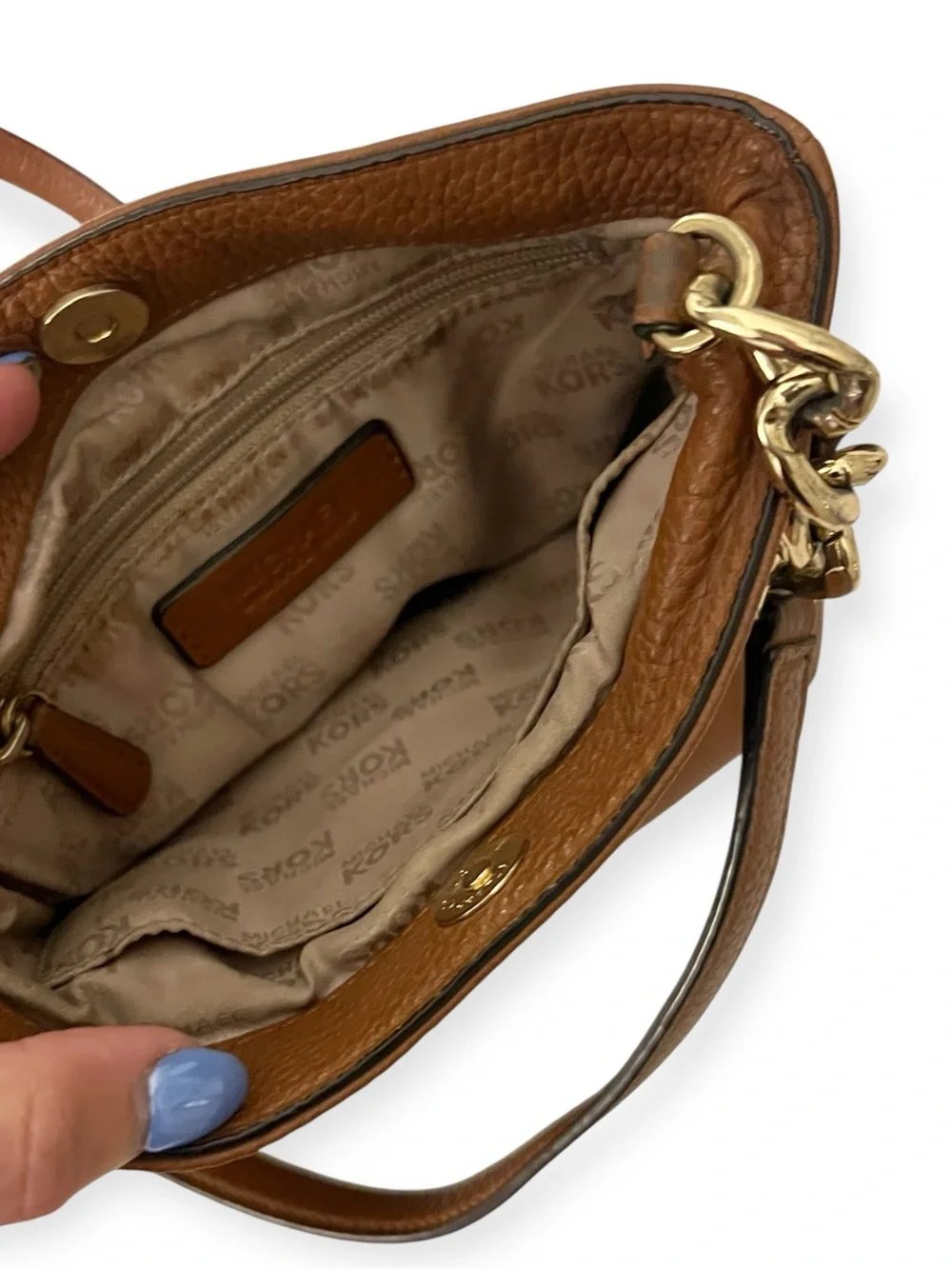Michael Kors features 	•	genuine